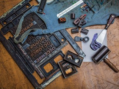 Tools and apron on table in workshop